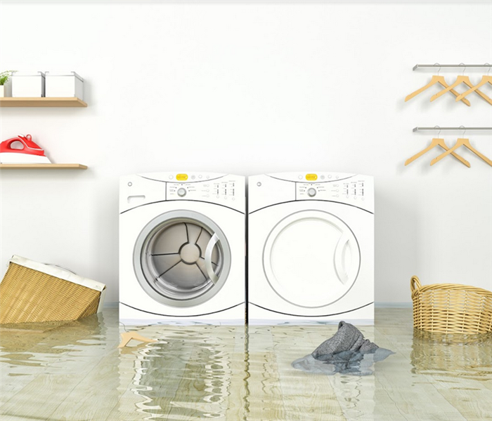 a flooded laundry room with water everywhere and laundry baskets floating