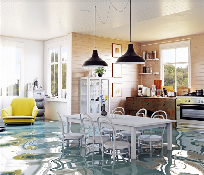 a flooded room of a house with water covering the floor