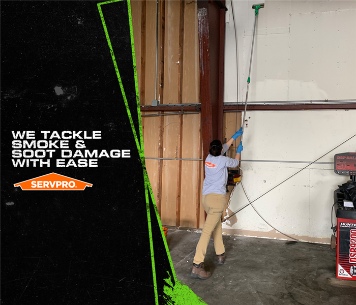 SERVPRO tech cleaning the soot 